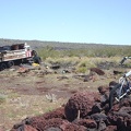 A mountain bike rests in the cinder-rock pile near the old dump truck at Aiken Mine, Mojave National Preserve
