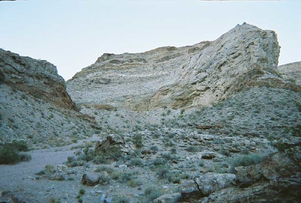 Though concealed in this view, the tent sits behind a small rocky outcrop in the centre of this photo in Monarch Canyon