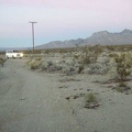 My dirt road from Coyote Springs ends at dusk when I reach the Kelbaker Road &quot;highway&quot;