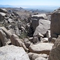 From this saddle in the Eagle Rocks, I look into the haze southwest across Mojave National Preserve