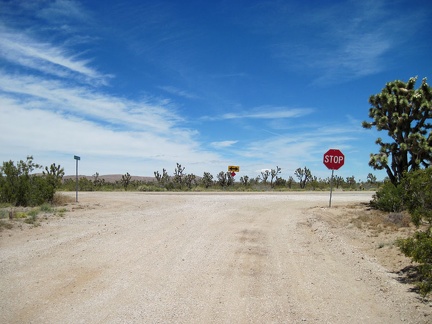 Stop sign in the desert: after 11 dirt-road miles, I reach the end of Walking Box Ranch Road