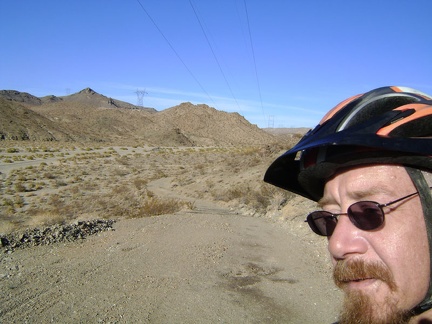 At the top of my little hill, I now get to ride back down the old paved road and return to the gravel of Jackass Canyon