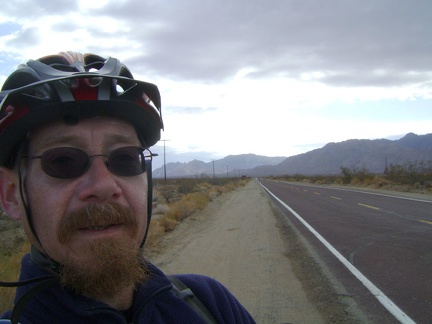 At the end of Kelso Dunes Road, I start riding down the paved Kelbaker Road, with the Granite Mountains behind me