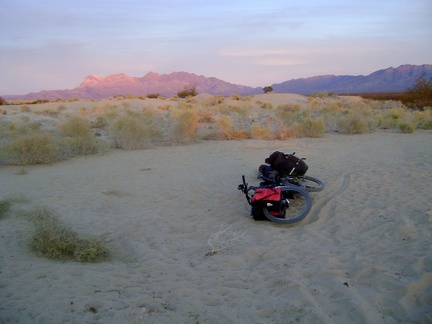 I take a very short break at the end of Kelso Dunes Road, enjoying the pink Providence Mountains, to consider my camping options