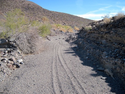 I continue hiking up &quot;South Broadwell Wash,&quot; following an old set of dirt-bike tracks