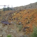 I reach the orange tailings pile at Columbia Mine and see a "danger" sign