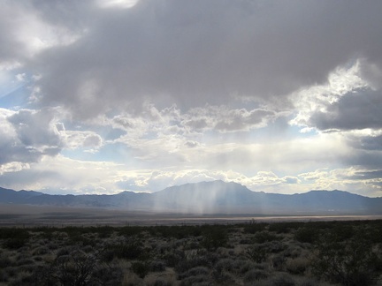 It looks like a few rainy patches are moving around out in the middle of Ivanpah Valley