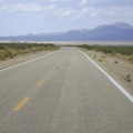 Still rolling quickly downward on Morning Star Mine Road, Ivanpah Valley comes clearer into view