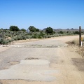 Cedar Canyon Road east of the Mid Hills is mostly unpaved, except for this short stretch by a cattle guard