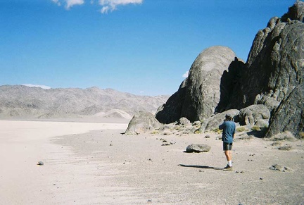 Phil stands on "the beach" at The Grandstand, in the middle of The Racetrack playa
