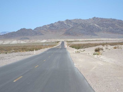 Just past Grimshaw Dry Lake, Tecopa Hot Springs Road heads straight toward the mountains