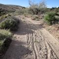 Immediately after the little detour on Castle Peaks Road is another sandy stretch, too deep for me to ride the 10-ton bike